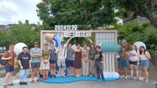 Students in front of sign in Taiwan