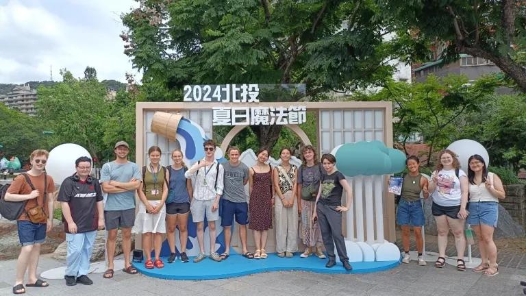 Students in front of sign in Taiwan