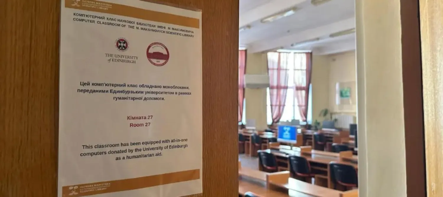 Door opening to reveal KNU's computer room