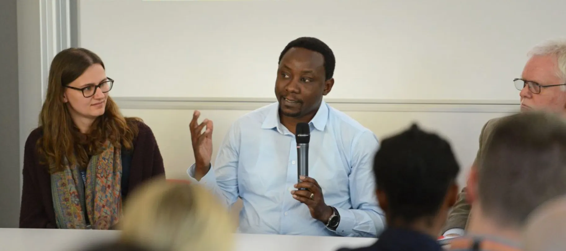 man speaking at conference