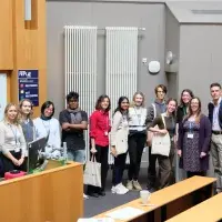 student organisers of sustainability workshop group photo in a lecture hall.