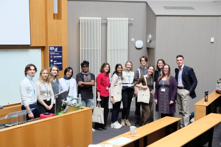 student organisers of sustainability workshop group photo in a lecture hall.