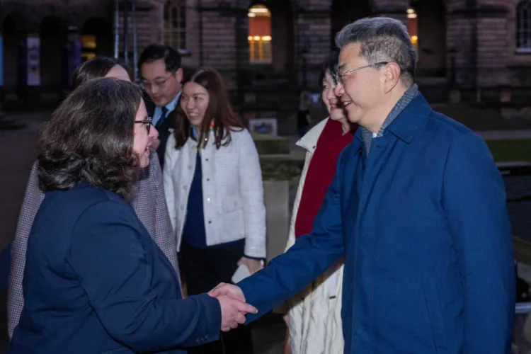 Chinese delegation shaking hands with Edinburgh member of staff