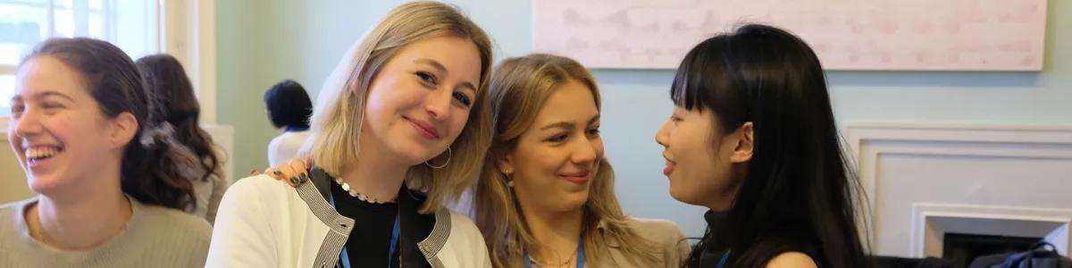 Students smiling at a student network event