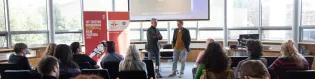 Two people discussing a film in front of an audience at the Edinburgh Spanish film festival 
