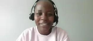A screenshot from a video call, showing Phenny Omondi speaking to the camera.