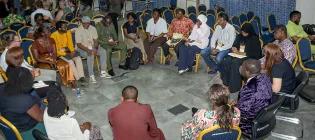 Symposium attendees gathered in discussion
